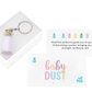 Keychain with a small bottle and a card with 'baby dust' cards for gifting.