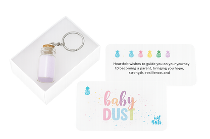 Keychain with a small bottle and a card with 'baby dust' cards for gifting.